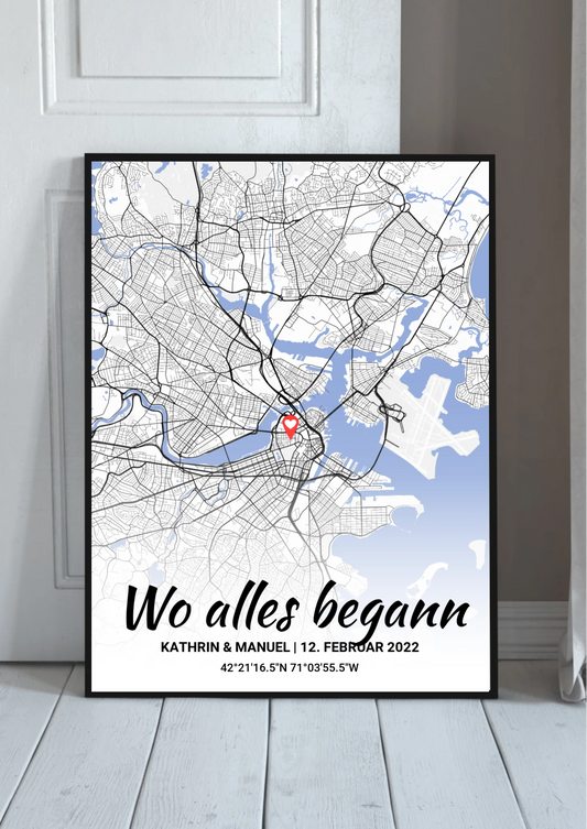 Wo alles begann Poster personalisiert – Stadtkarte mit blauem Wasser und Herz-Markierung, im schwarzen Rahmen angelehnt
