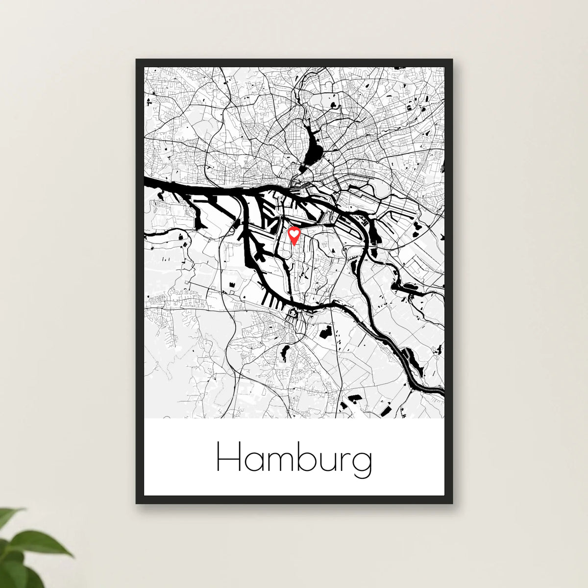Stadtkarten Poster personalisiert – im schwarzen Rahmen an heller Wand